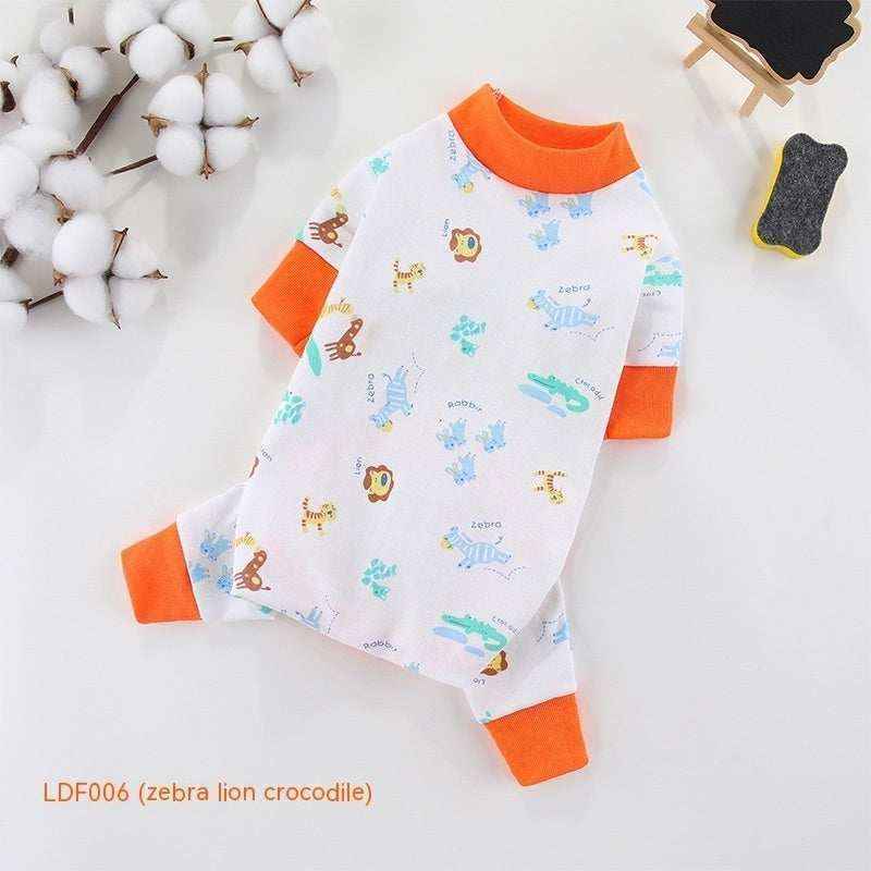 White baby onesie with orange cuffs and collar, featuring zebra, lion, and crocodile animal prints