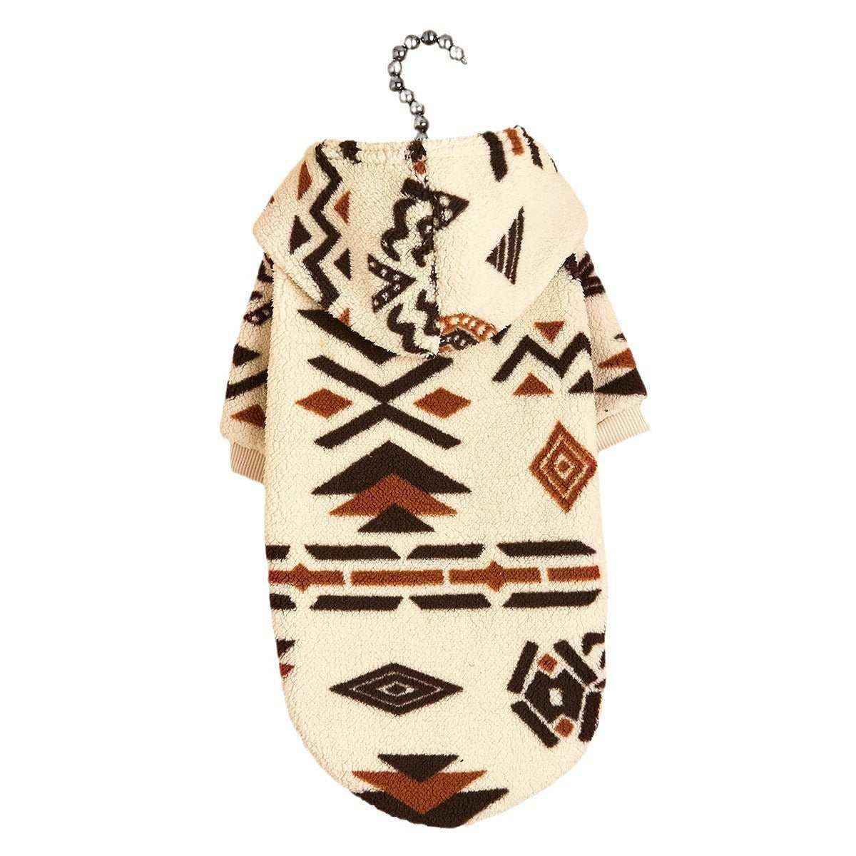 Cream fleece dog hoodie with brown and black tribal geometric patterns, hanging on a metal chain hanger