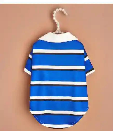 Blue and white striped pet shirt with white collar hanging on pearl hanger against beige background