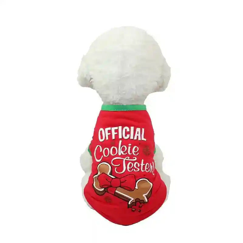 White dog wearing red holiday shirt with green trim and 'Official Cookie Tester' bone design
