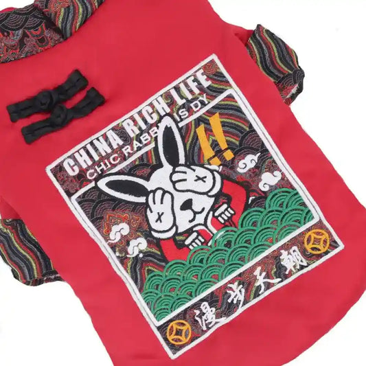 Red dog jacket with embroidered cartoon rabbit, rainbow patterns, Chinese characters, and decorative buttons