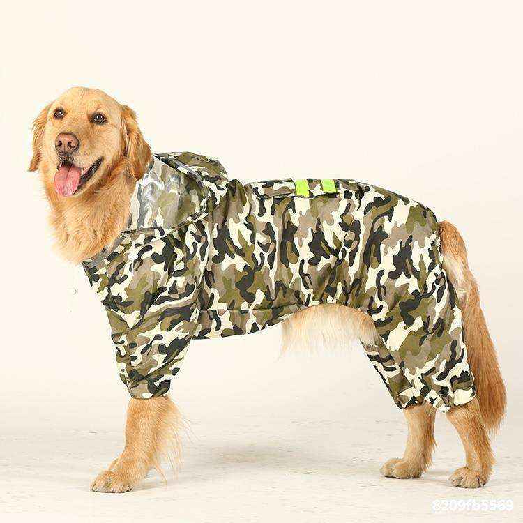 Golden retriever wearing a camo dog raincoat with hood and reflective strips