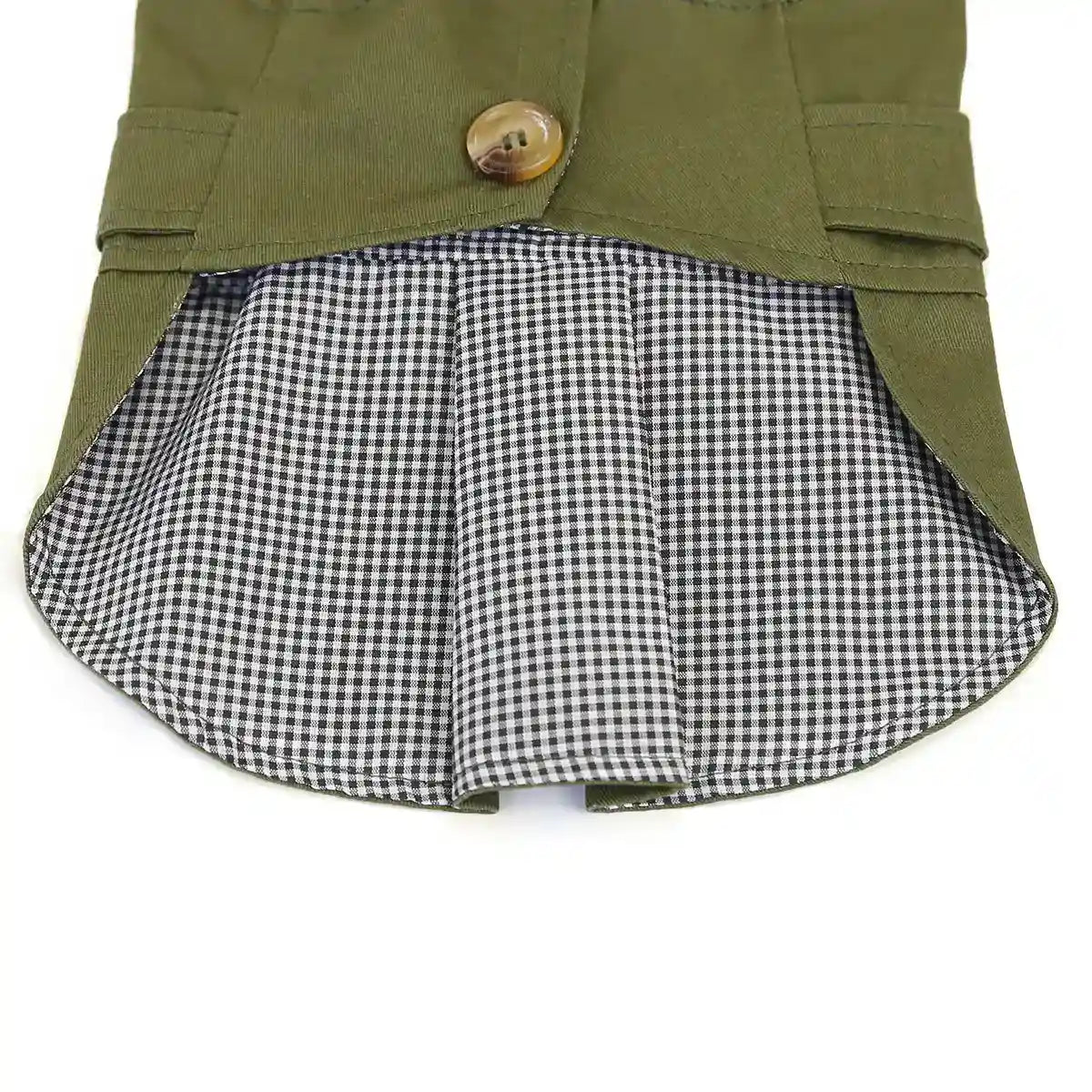 Green dog jacket with black and white checkered lining and brown button closure