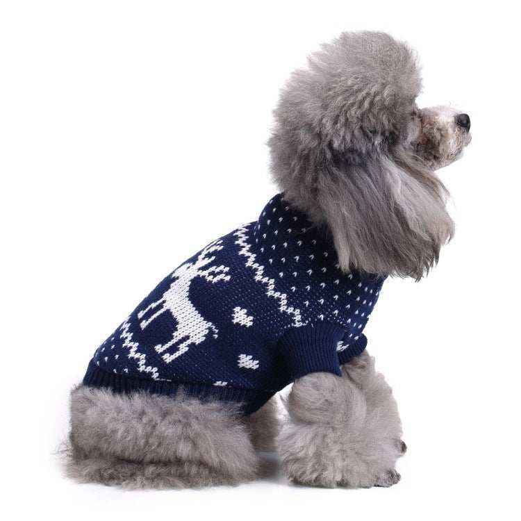 Gray poodle wearing navy blue Christmas sweater with white reindeer and heart patterns