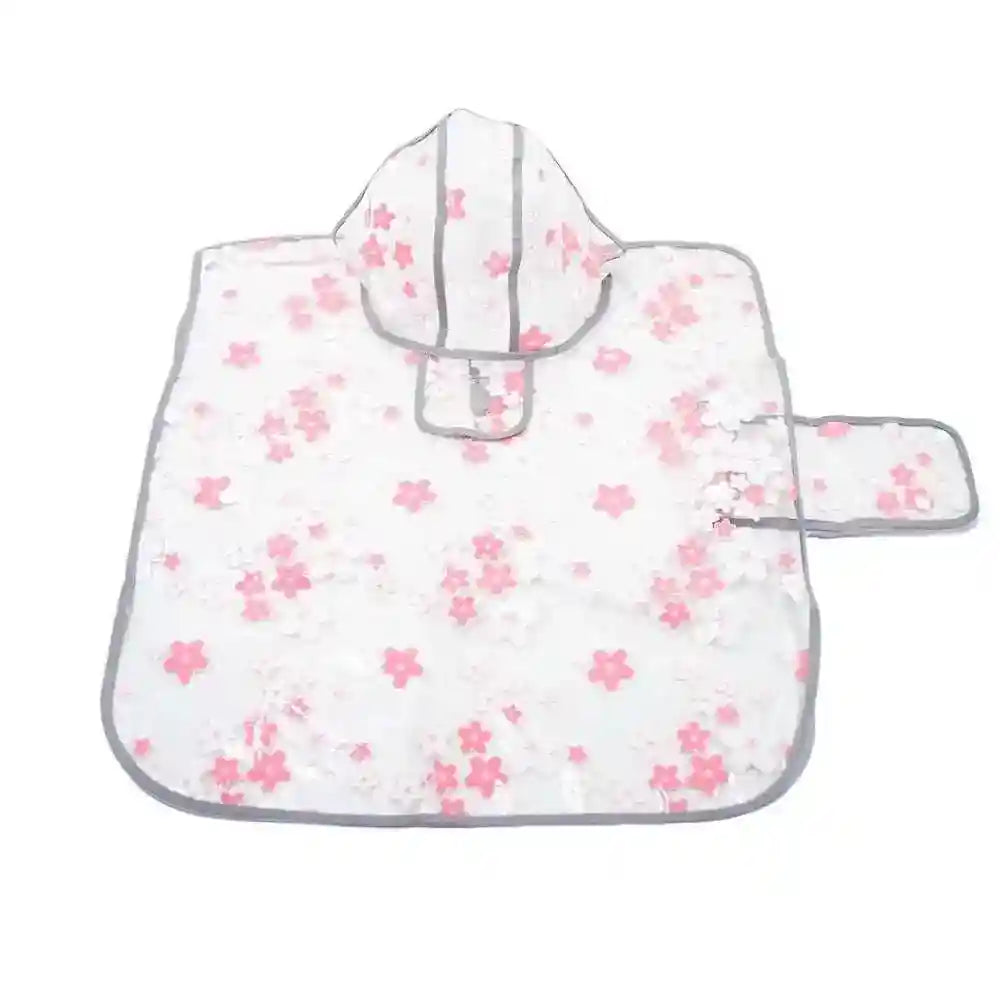 Child's hooded rain poncho with pink and white floral print and grey trim on white background
