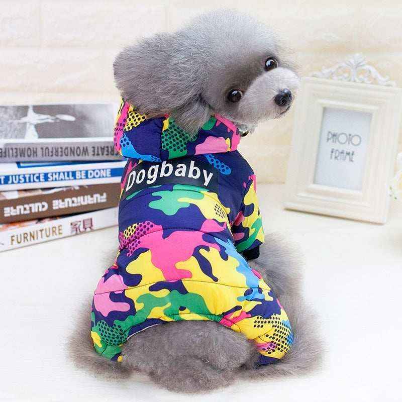 Gray poodle wearing colorful camouflage dog jacket with hood and Dogbaby text indoors