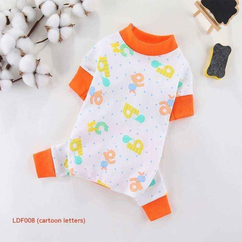 White dog pajamas with colorful cartoon letters and orange trim on a white background with cotton branches