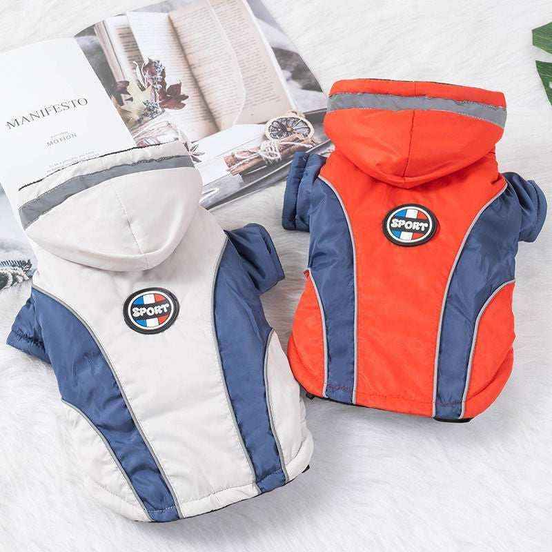Two sporty hooded dog jackets in blue-gray and orange with reflective stripes on white background