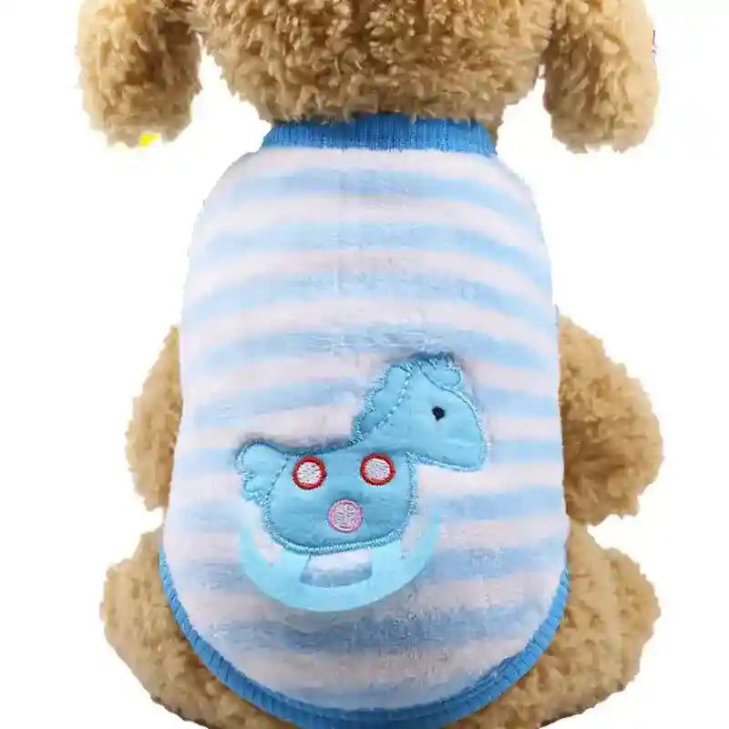 Small dog wearing soft blue and white striped sweater with rocking horse patch