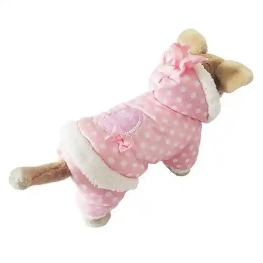 Small dog wearing pink polka dot winter jacket with hood and fur trim