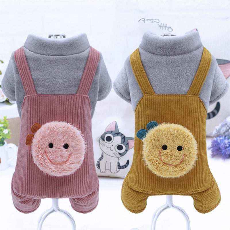 Two cozy pet outfits with gray fleece tops and corduroy overalls in pink and mustard, smiling face patches