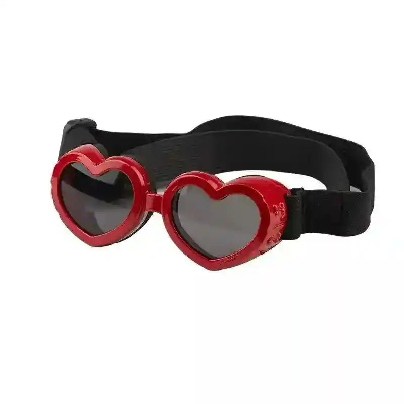 Red heart-shaped goggles with dark lenses and adjustable black strap