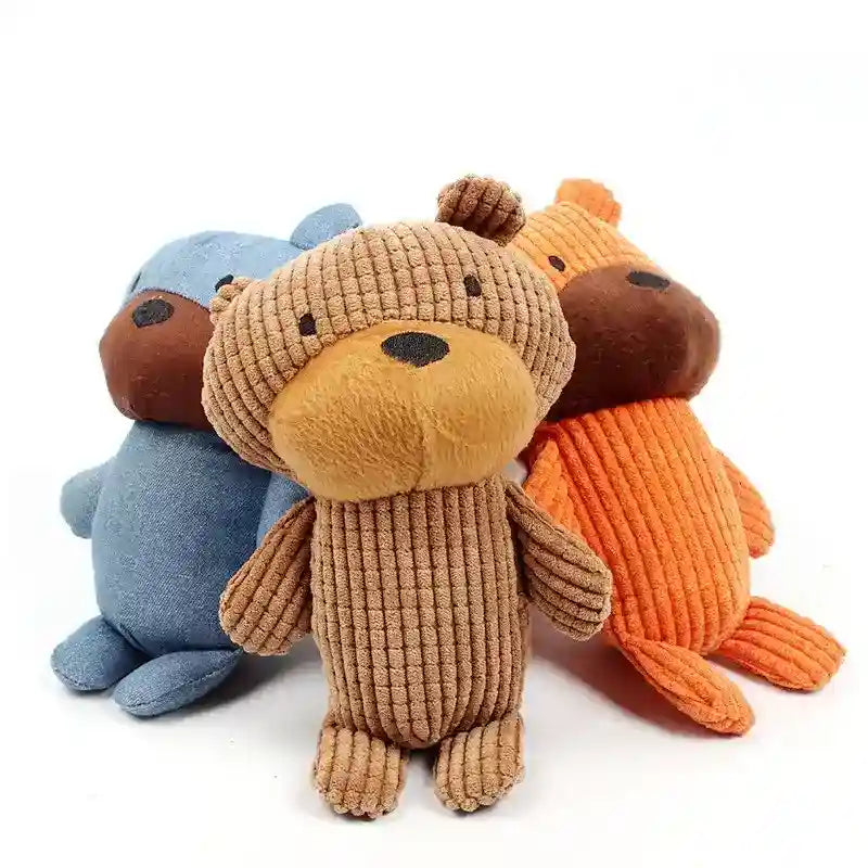 Three plush teddy bears in blue, brown, and orange corduroy fabric sitting on white background