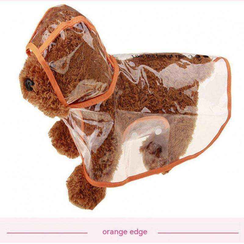 brown teddy bear wearing a transparent raincoat with orange edges on a white background