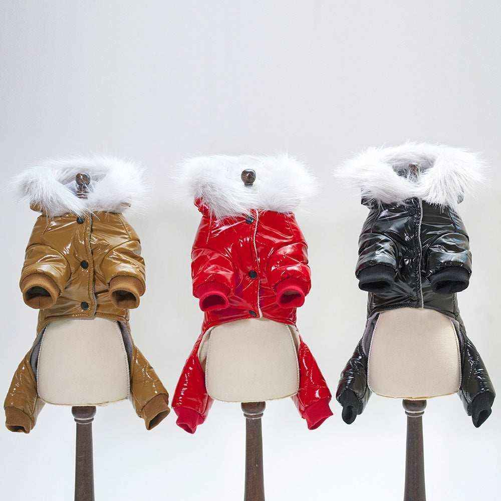 Three glossy puffer dog jackets in brown, red, and black with white faux fur collars on mannequins