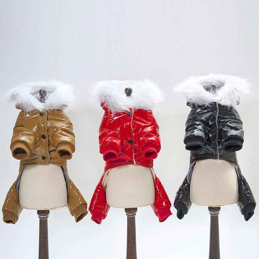 Three glossy puffer dog jackets in brown, red, and black with white faux fur collars on mannequins