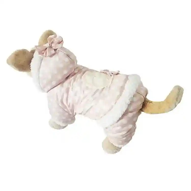 Small dog wearing a pink polka dot hooded winter jacket with faux fur lining and bow detail