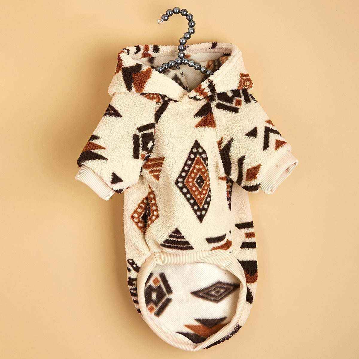 Beige and brown Aztec print fleece dog hoodie with short sleeves on black bead hanger