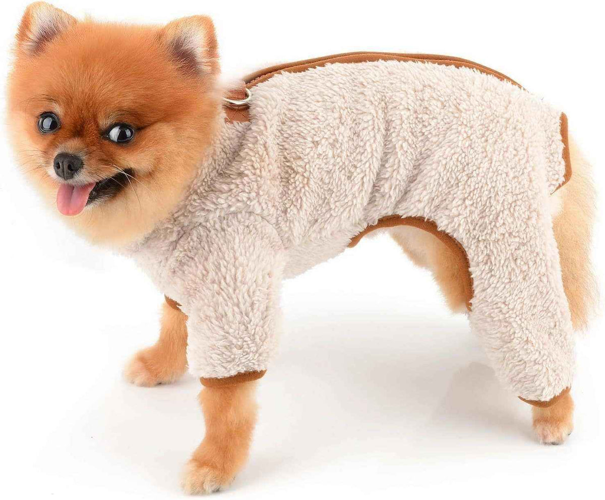 Pomeranian dog wearing a beige fluffy fleece dog jumpsuit against white background