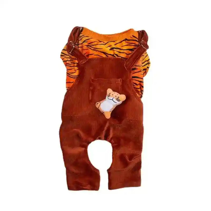 Infant brown corduroy overalls with orange tiger-striped shirt and small tiger plush on pocket