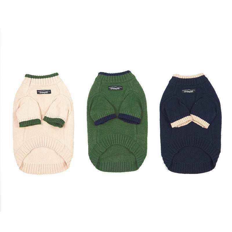 Three cozy dog sweaters in cream, green, and navy with contrasting trim and cheepet label