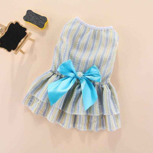 Striped pet dress with blue and yellow vertical lines, featuring a large blue bow with pearl detail