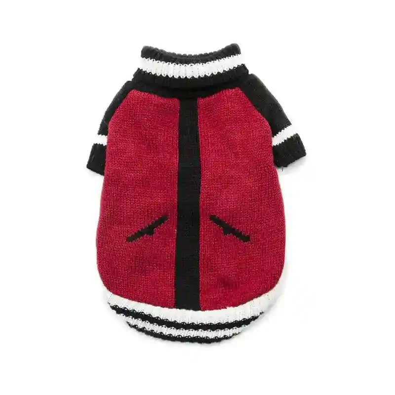 Red and black knitted dog sweater with white striped collar and cuffs on white background