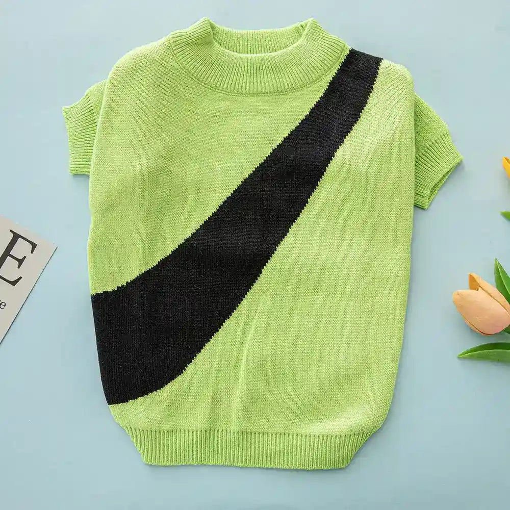 Light green short-sleeve knitted sweater with black diagonal stripe on blue background
