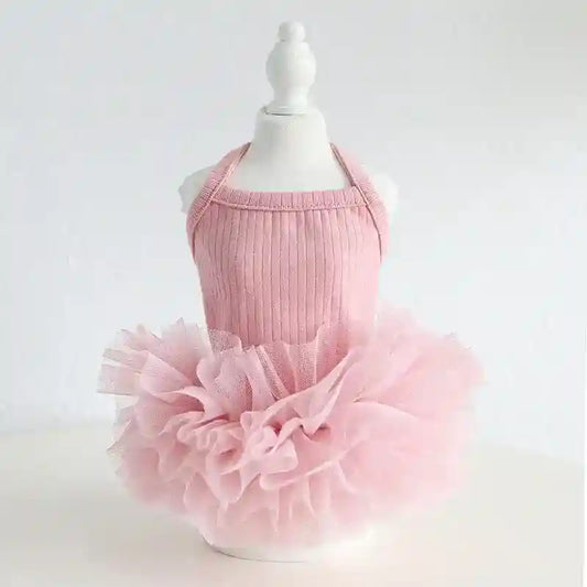Pink toddler ballet tutu dress on white mannequin with ribbed knit bodice and fluffy tulle skirt