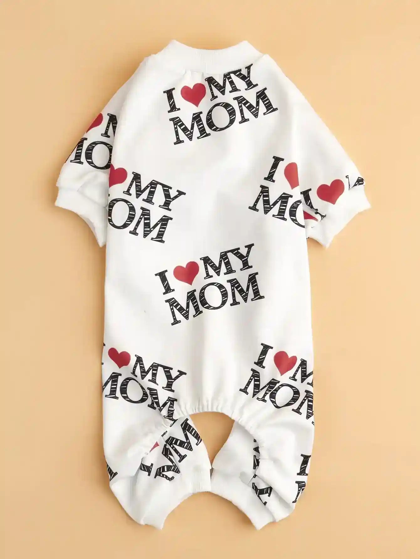 White baby romper with repeated black text I love my mom and red hearts on beige background