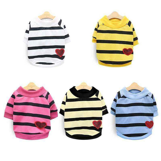 Five striped pet sweaters in white, yellow, pink, cream, and blue with black stripes and red heart patches