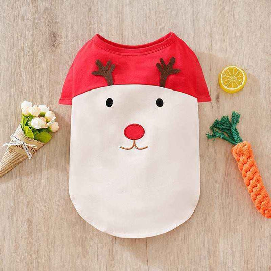 Christmas reindeer pet costume with red top and white face design on wood background