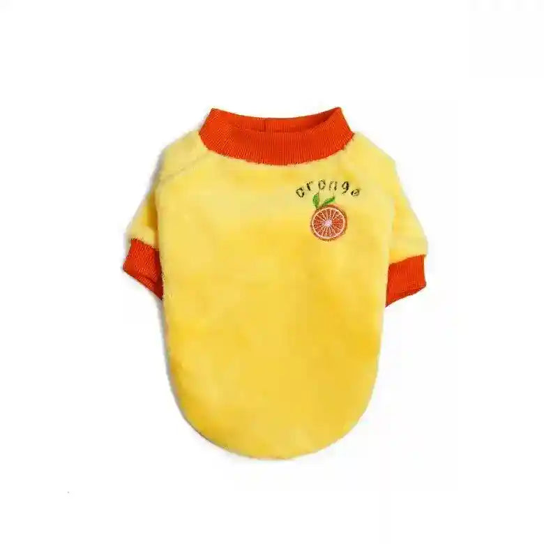 Yellow fluffy pet sweater with orange ribbed collar and sleeves, embroidered orange fruit and text