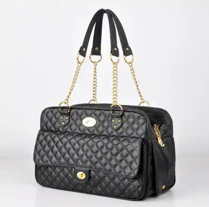 Black quilted eco leather handbag with gold chain handles and front pocket against white background