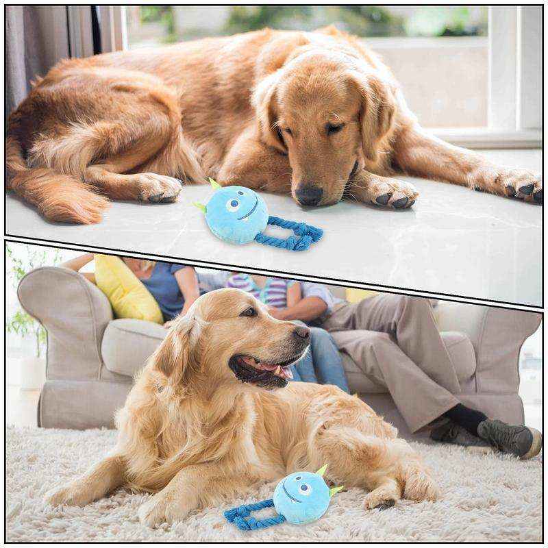 Golden retriever dog resting indoors near a blue plush toy with rope handles