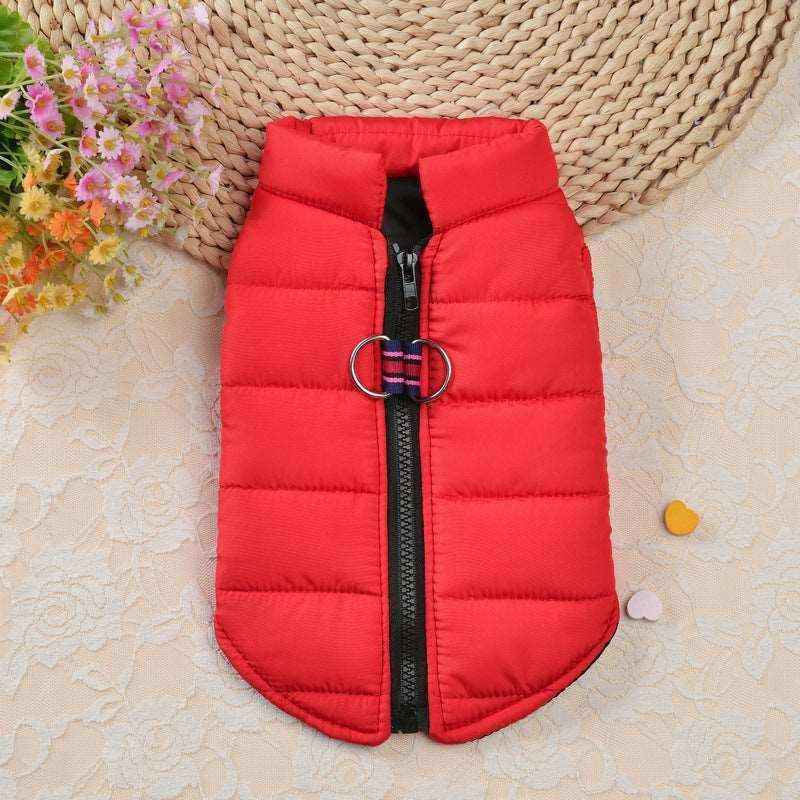 Red padded dog jacket with black zipper and D-ring on lace tablecloth with flowers