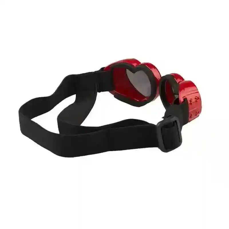 Red heart-shaped goggles with black adjustable strap on white background