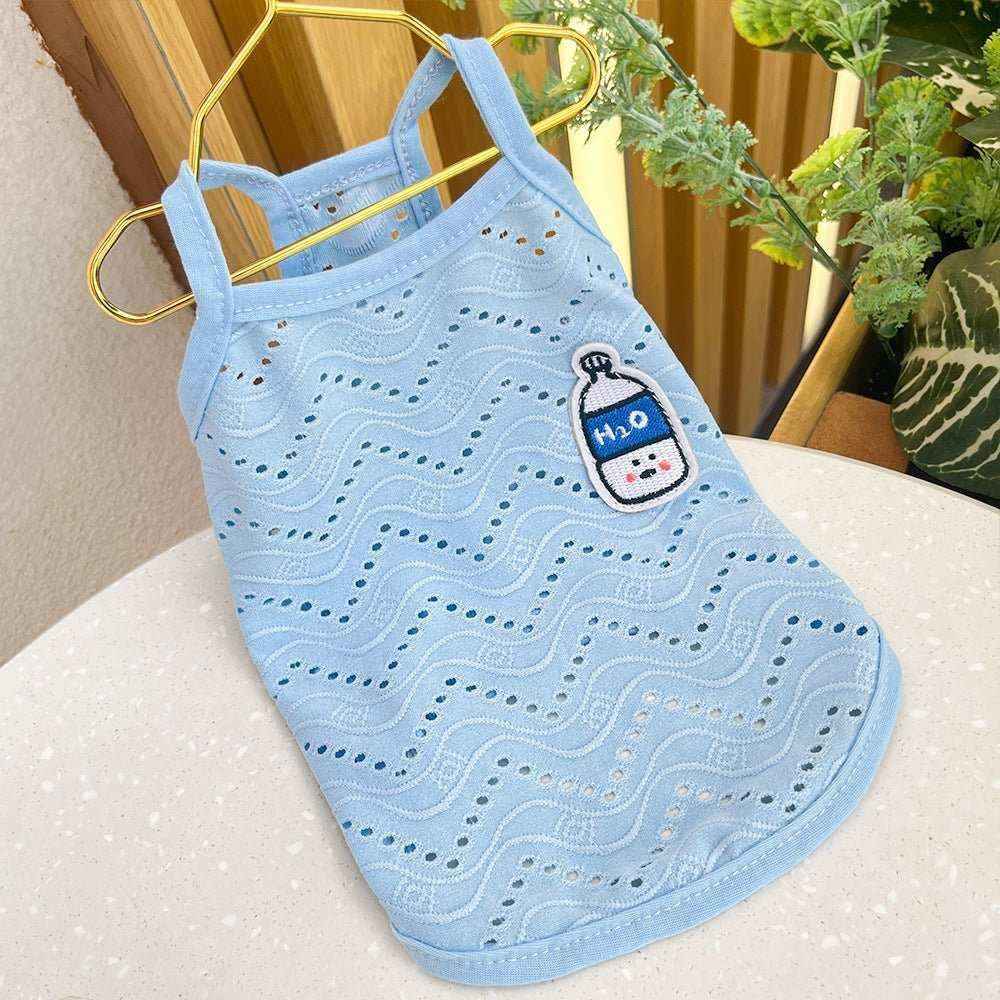 Light blue breathable dog tank top with wave cutout pattern and H2O water bottle patch hanging on gold hanger