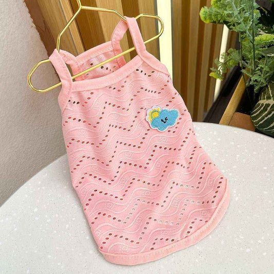 Pink breathable dog tank top with wavy cut-out pattern and cute cloud patch on gold hanger