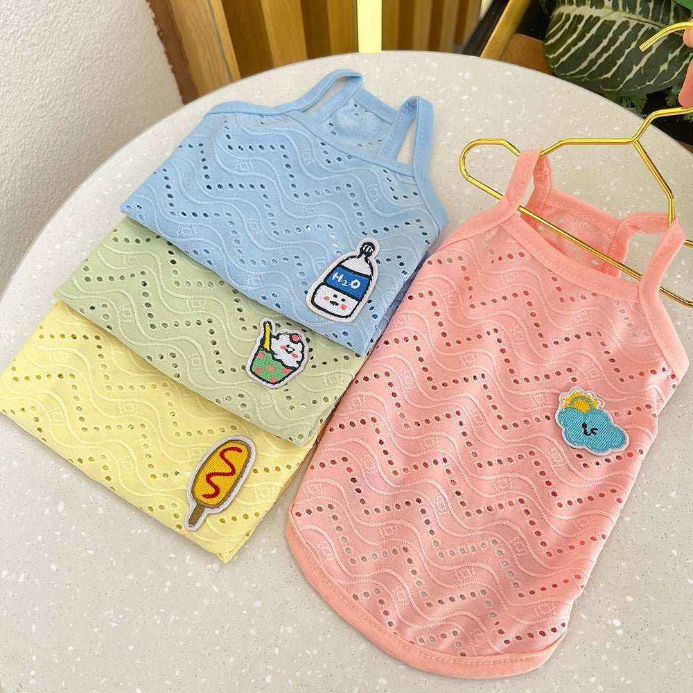 Colorful breathable dog tank tops with cute patches on white round table