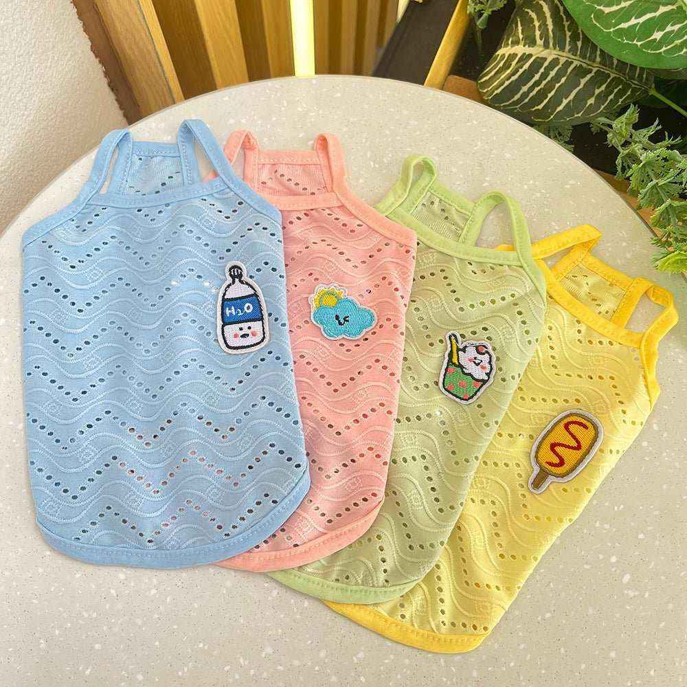 Four colorful breathable dog tank tops in blue, pink, green, and yellow with cute food and cloud patches