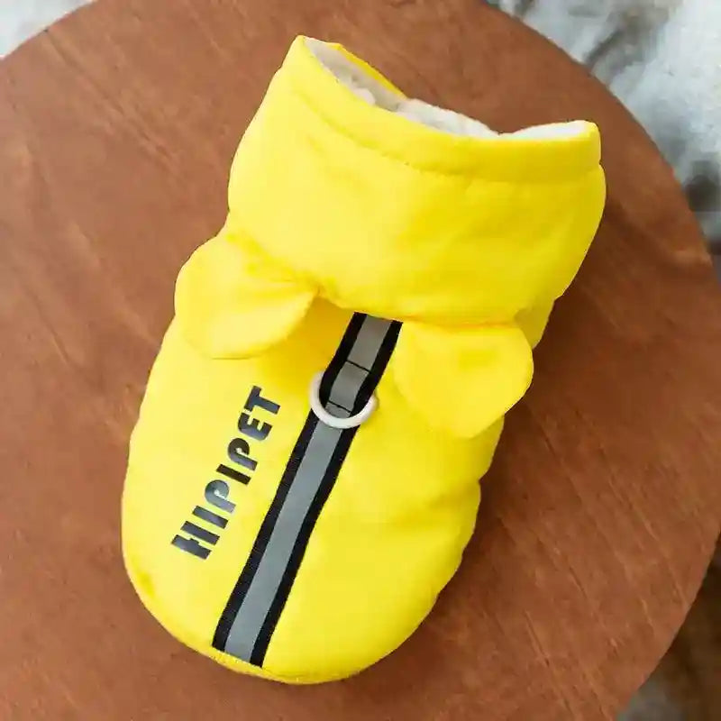 Bright yellow pet jacket with hood and ears, reflective strip and leash ring on wooden surface