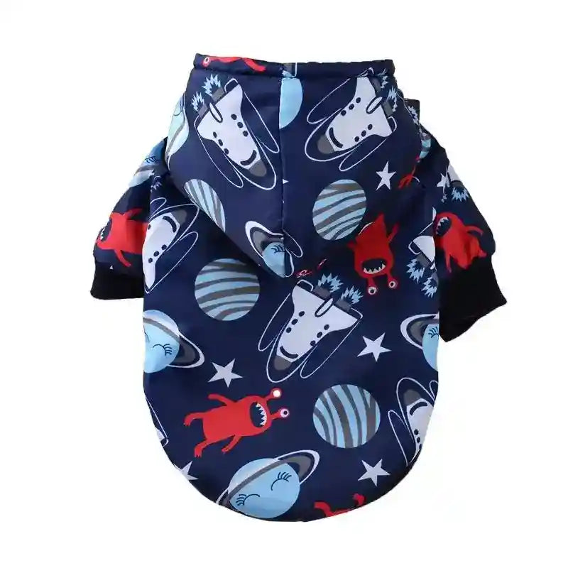 Navy blue dog jacket with hood, space-themed print featuring planets, stars, and red aliens