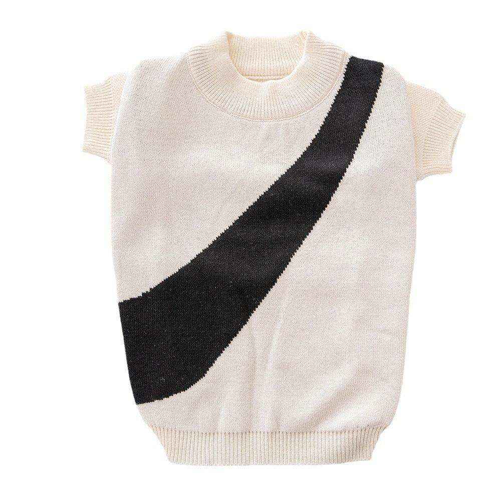 Cream knit sweater vest with short sleeves and bold black diagonal stripe design