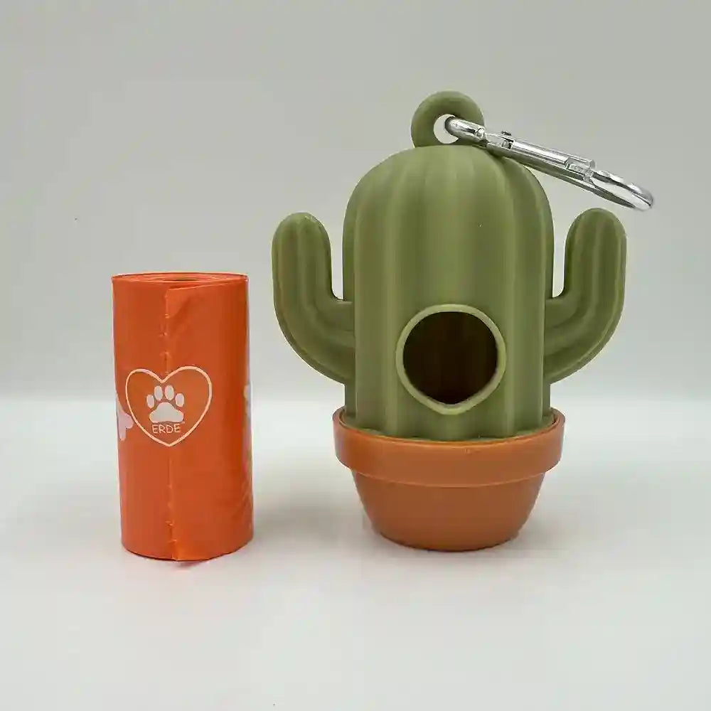 Green cactus-shaped dog waste bag dispenser with clip and orange waste bag roll on white background
