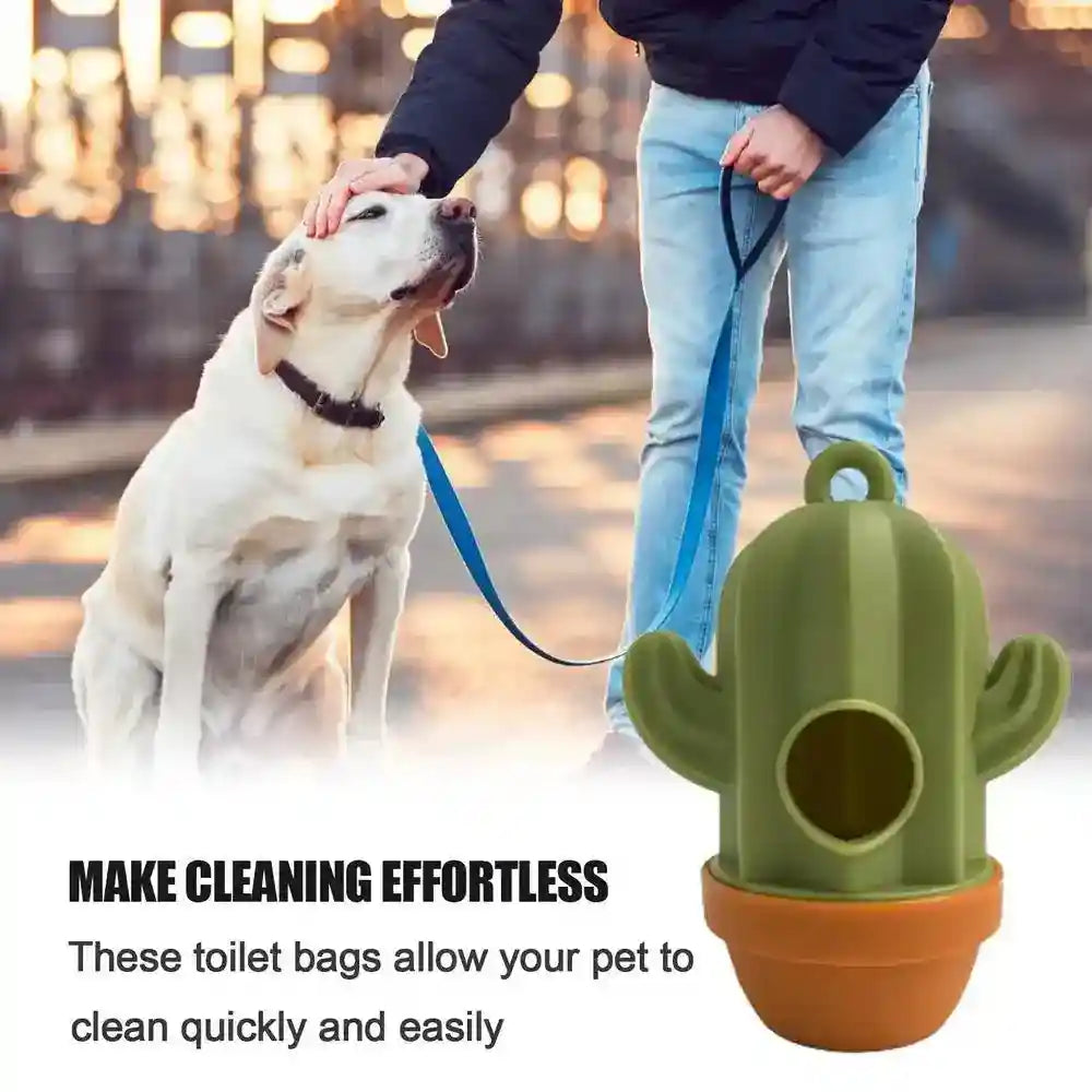 Green cactus-shaped dog poop bag dispenser with terracotta pot base, held by person walking a dog