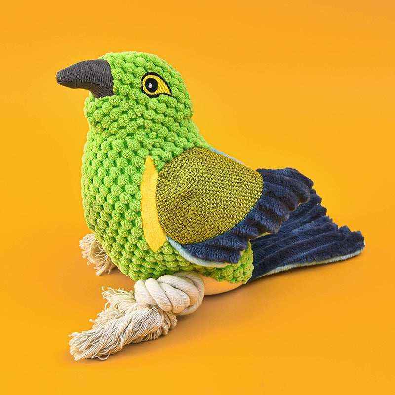 Green and blue textured bird dog toy with rope feet on orange background