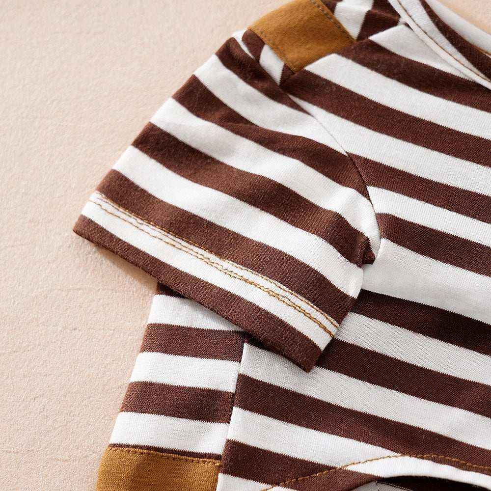 Close-up of brown and white striped short sleeve cotton fabric on beige surface