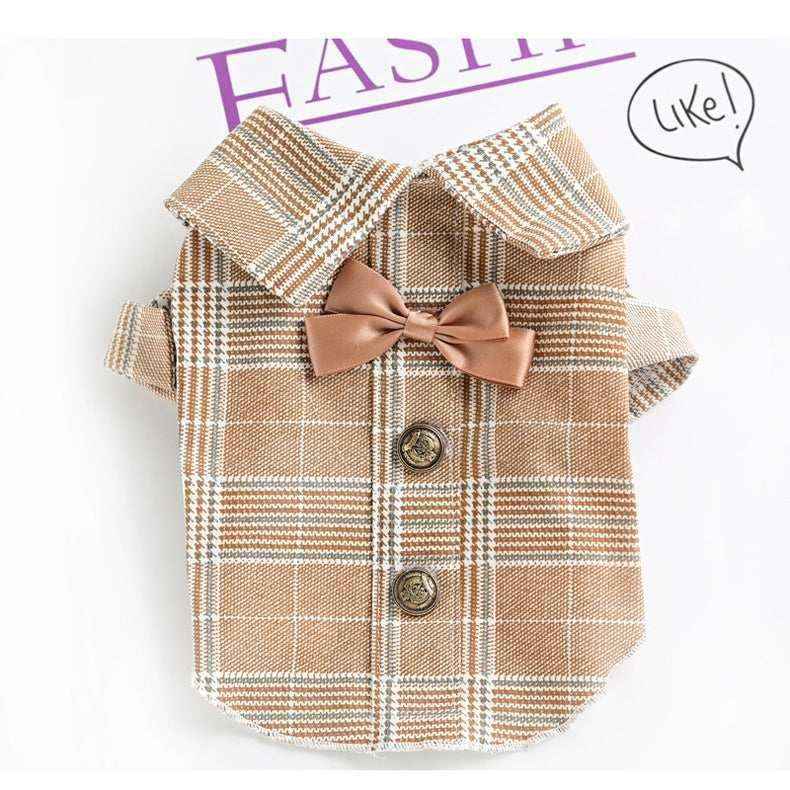 Brown plaid dog shirt with buttons and matching brown bow tie on white background