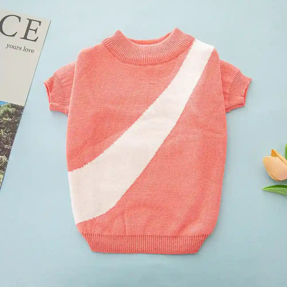 Coral short-sleeve knit sweater with white diagonal stripe on blue background